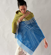 woman wearing shawl blue and moss green on white background
